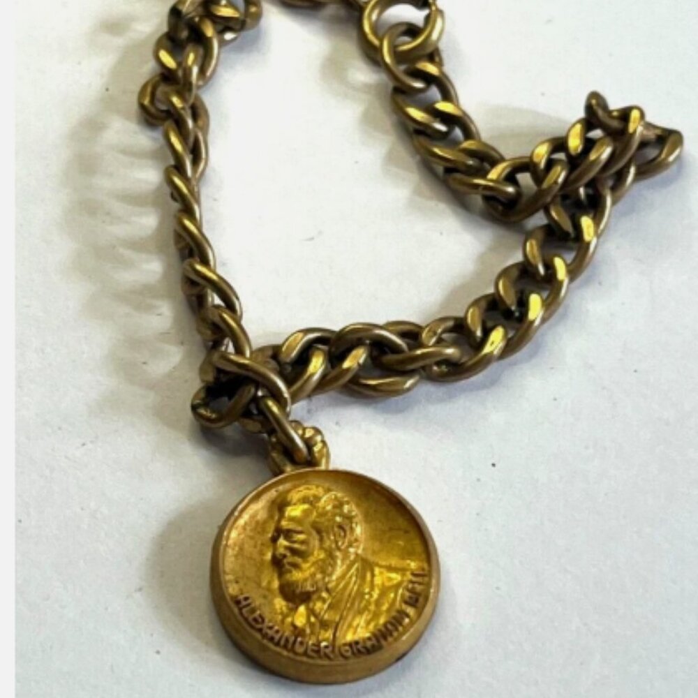 VINTAGE 10K O.C. Tanner Jewelry Co. "Alexander Graham-Bell" charm on Bracelet